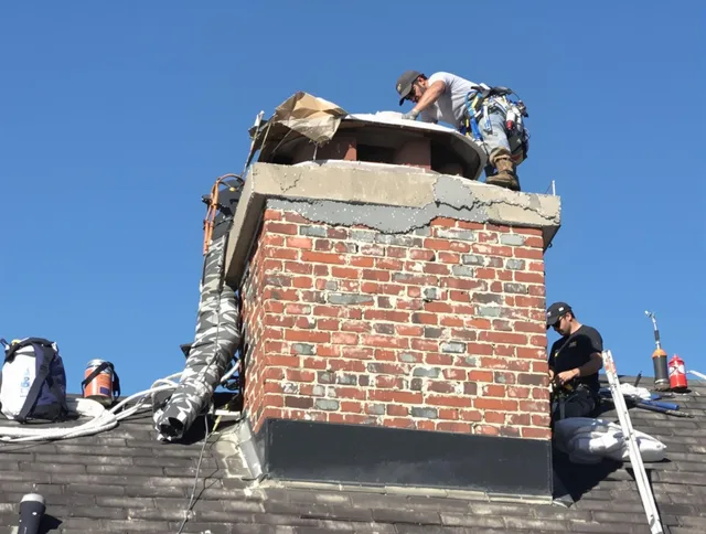 La Verne Chimney Sweep installing a custom chimney crown in La Verne, CA